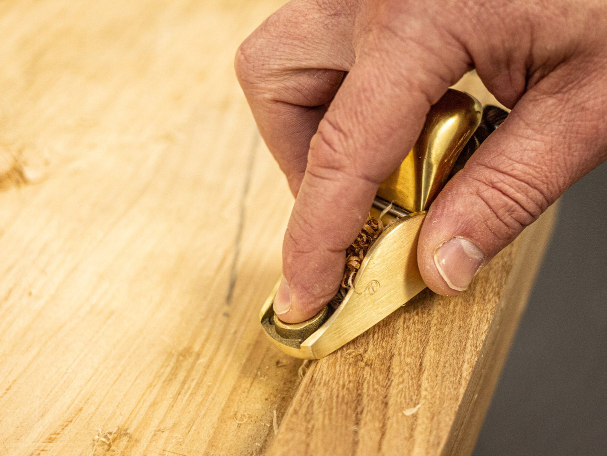 Luban No.101 Bronze Apron Hand Plane angled view with wooden handle and bronze body