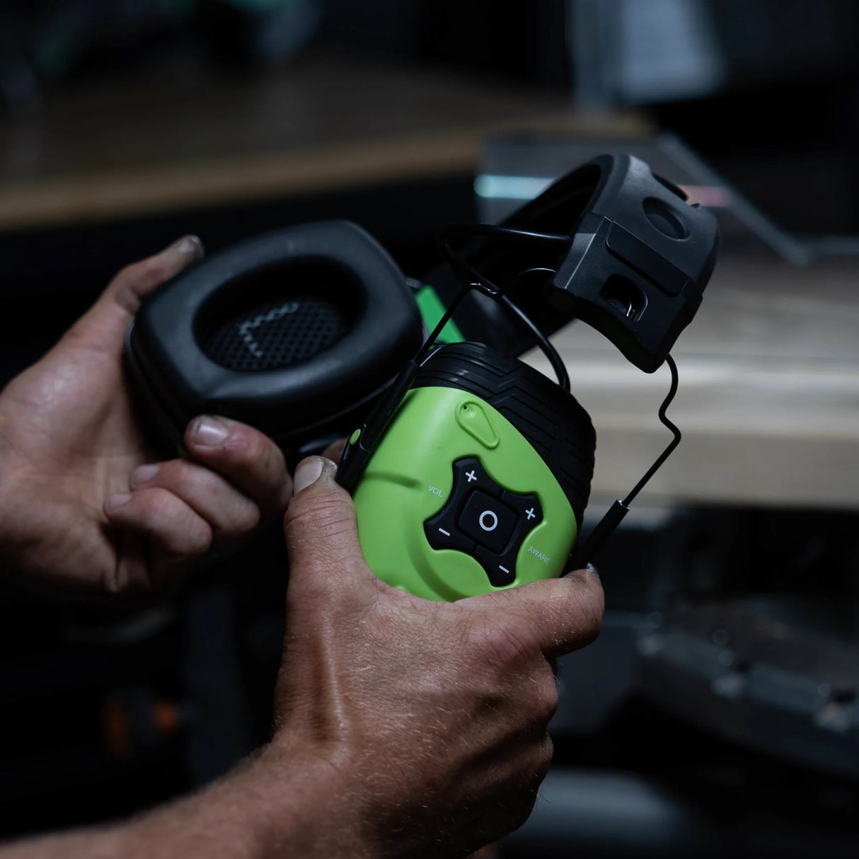 ISOtunes LINK Aware Bluetooth Earmuffs in Green/Black - angle view showing Bluetooth headphones for woodworking