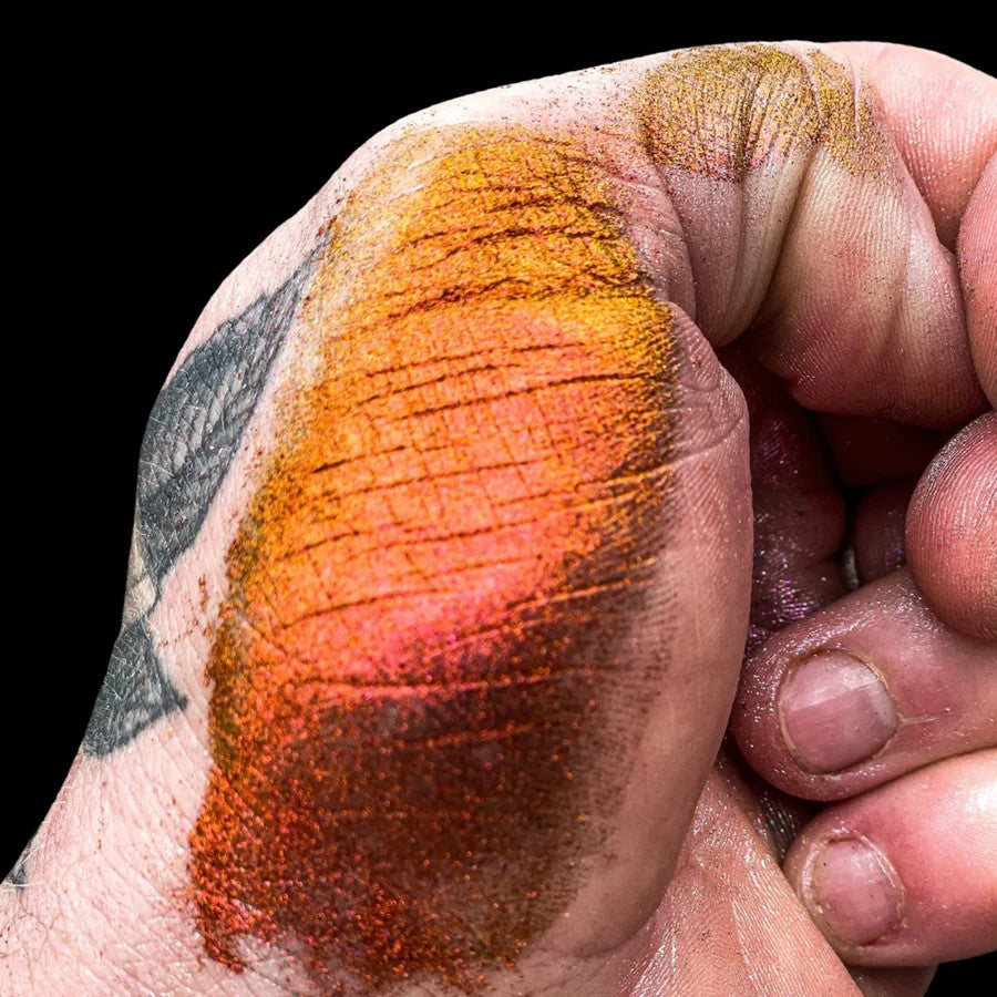 Vibrant orange, red, gold, and green Super Chameleon Mica Pigment for epoxy resin on timber edge