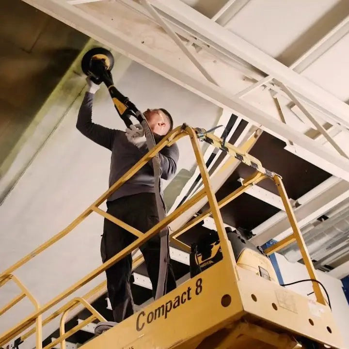 Mirka LEROS-S wall sander in action, delivering efficient sanding results