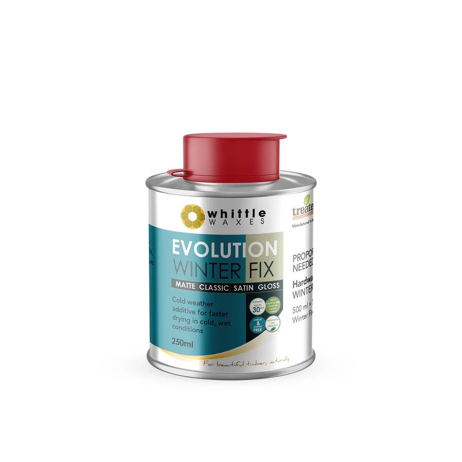 Whittle Waxes Evolution Winter Fix Cold Weather Additive 250mL bottle against a rustic wooden background