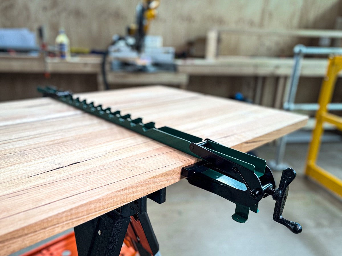 Torquata Set of 4 Panel Clamps Dual Steel Bar Style in use for clamping large panel during woodworking