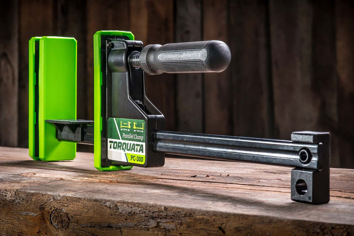 Torquata Set of 6 Parallel Clamps in action, securing a large woodworking panel