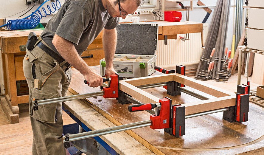Bessey K-Body Clamps with framing block set in various sizes, showcasing enhanced parallel clamping surface and mounting capability
