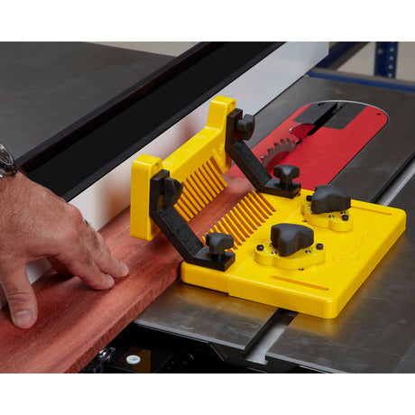 Magswitch Reversible Magnetic Featherboard Starter Kit with Vertical Featherboard attachment in use on woodworking table