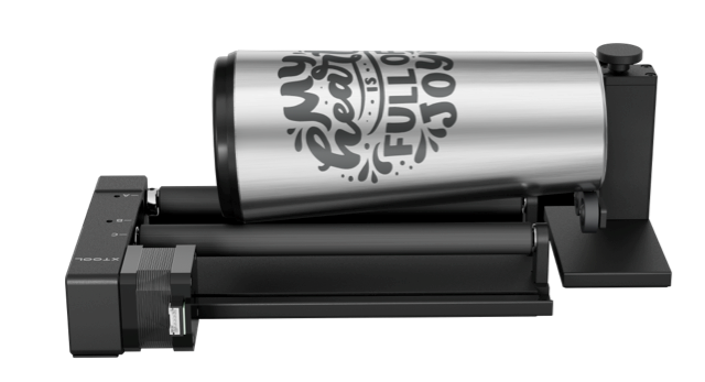 Versatile xTool RA2 Rotary Attachment laser-engraving a wine glass. Ideal for round objects like tumblers, baseball bats, rings, balls, or mugs