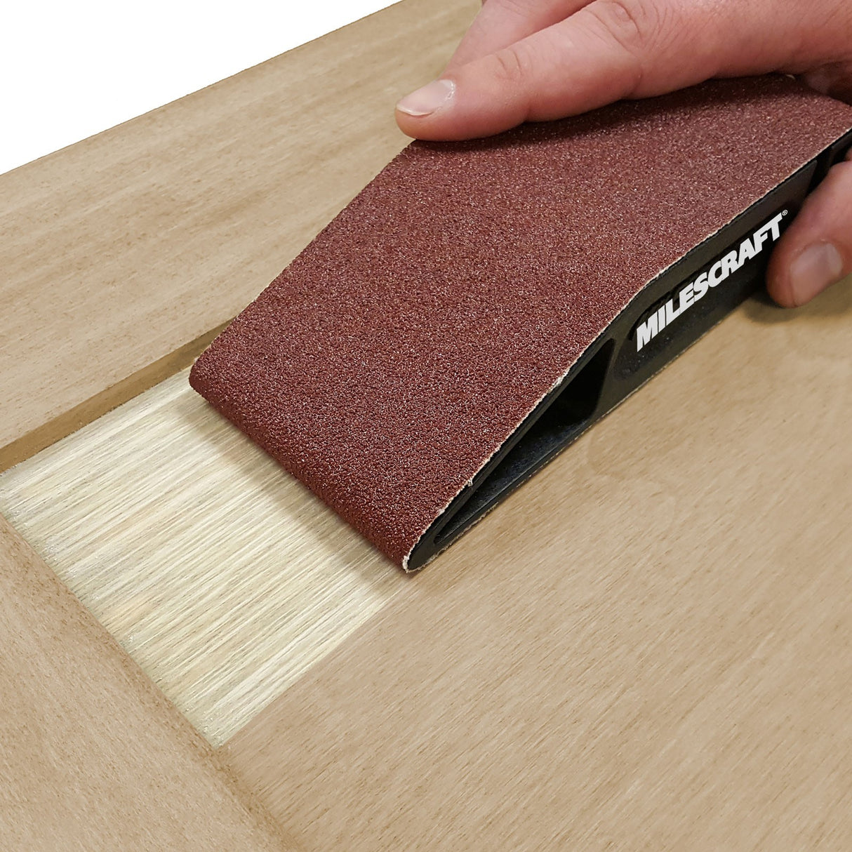 Milescraft SandDevil 2.5 Hand Sander & Belt Set showcasing its multi-surface design for versatile sanding applications