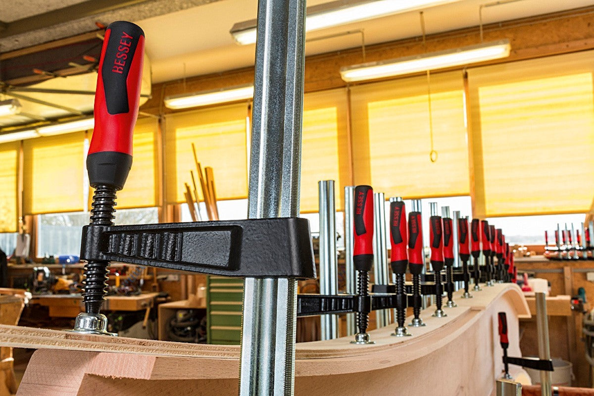 Bessey Set of 4 Quick Action Clamps TG Series 250mm Soft Grip - Side view with clamps secured on a workpiece