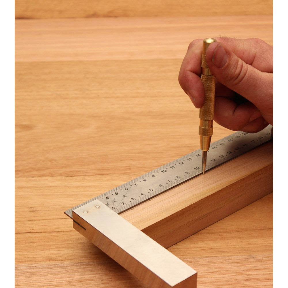 Australian-made Automatic Centre Punch with brass handle and hardened steel point for accurate center marking