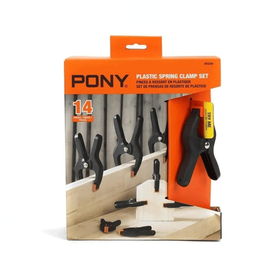 Pony Jorgensen Set of 14 Plastic Spring Clamps with Pivoting Jaw Pads in action at woodworking workshop