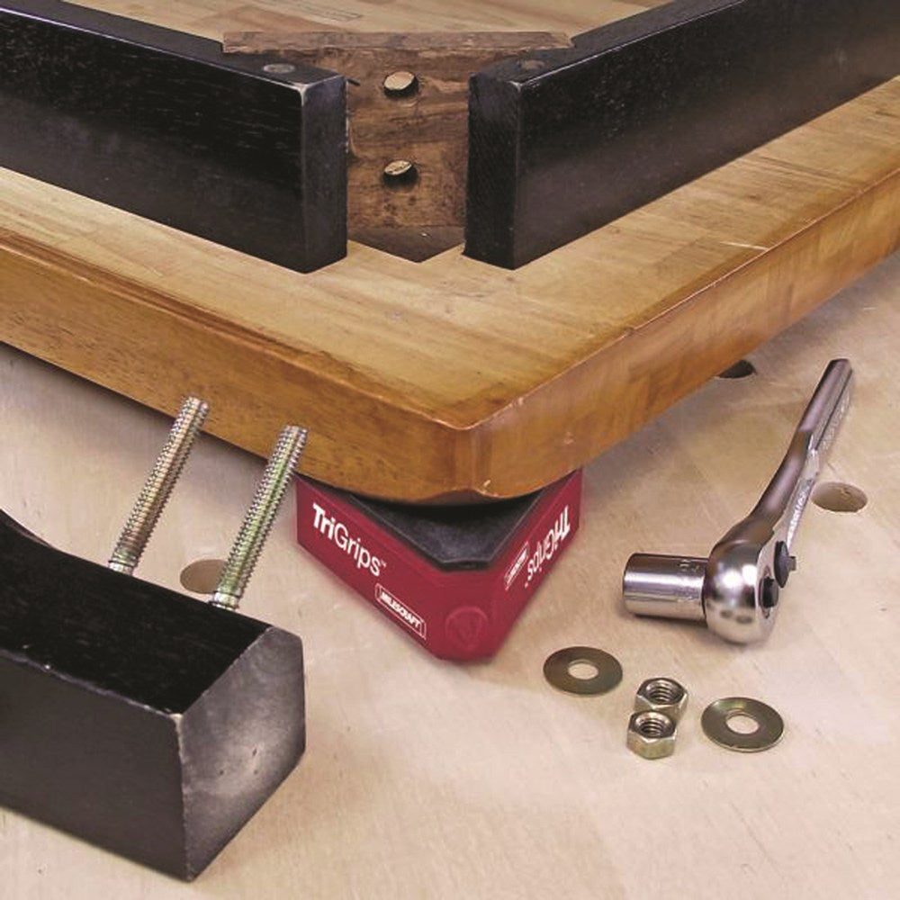 Milescraft TriGrips work holding feet in use on woodworking bench