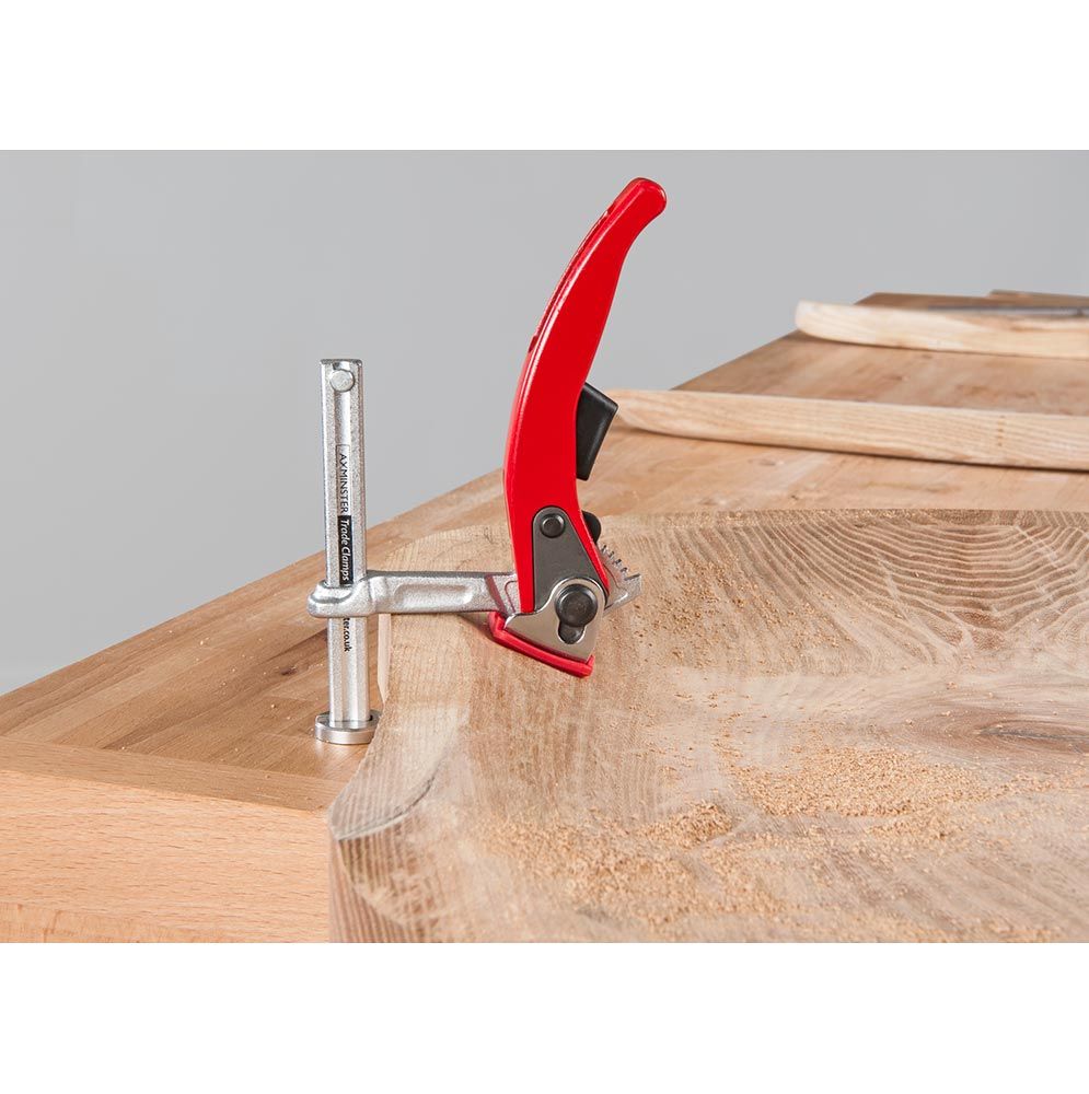 UJK Hold Down Ratchet Clamp in action on woodworking table with 60mm throat depth