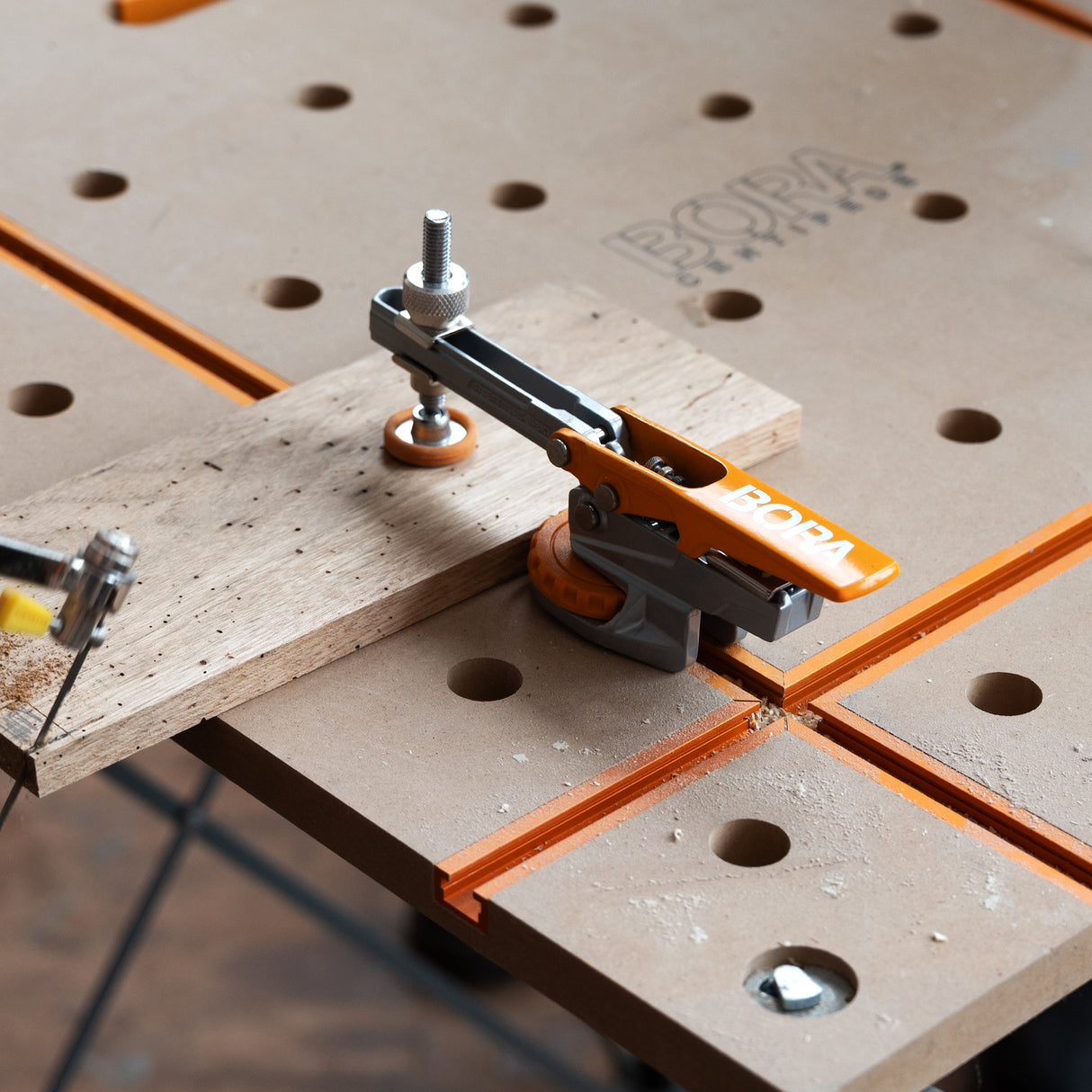 BORA Tool Auto Adjust T-Track Standard Toggle Clamp in use on woodworking project