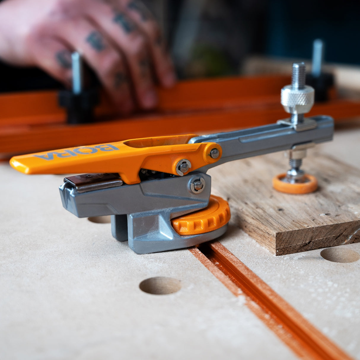 BORA Tool Auto Adjust T-Track Standard Toggle Clamp in use on workbench