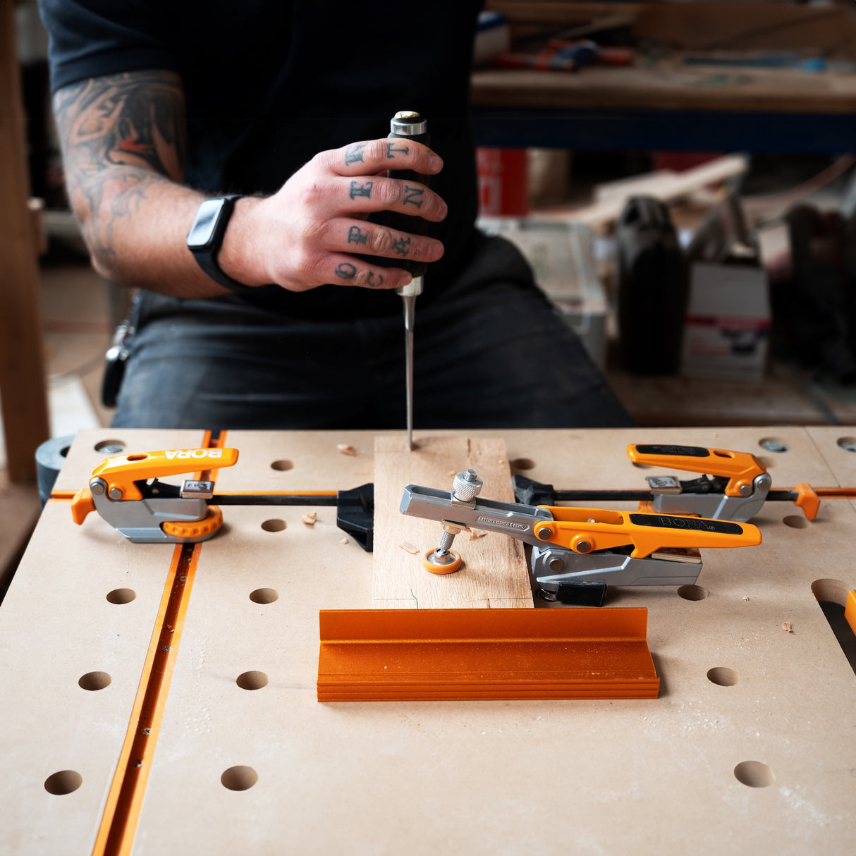 BORA Tool Auto Adjust Inline T-Track Toggle Clamp in use on woodwork project