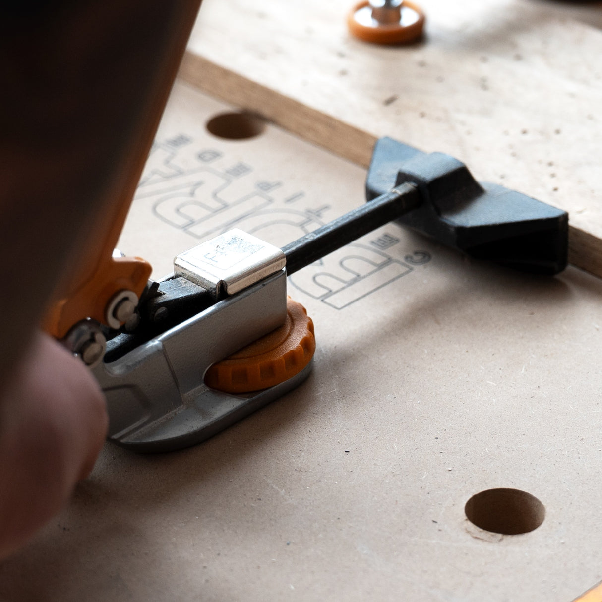 BORA Tool Dog Hole Auto Adjust Clamp in action on workbench