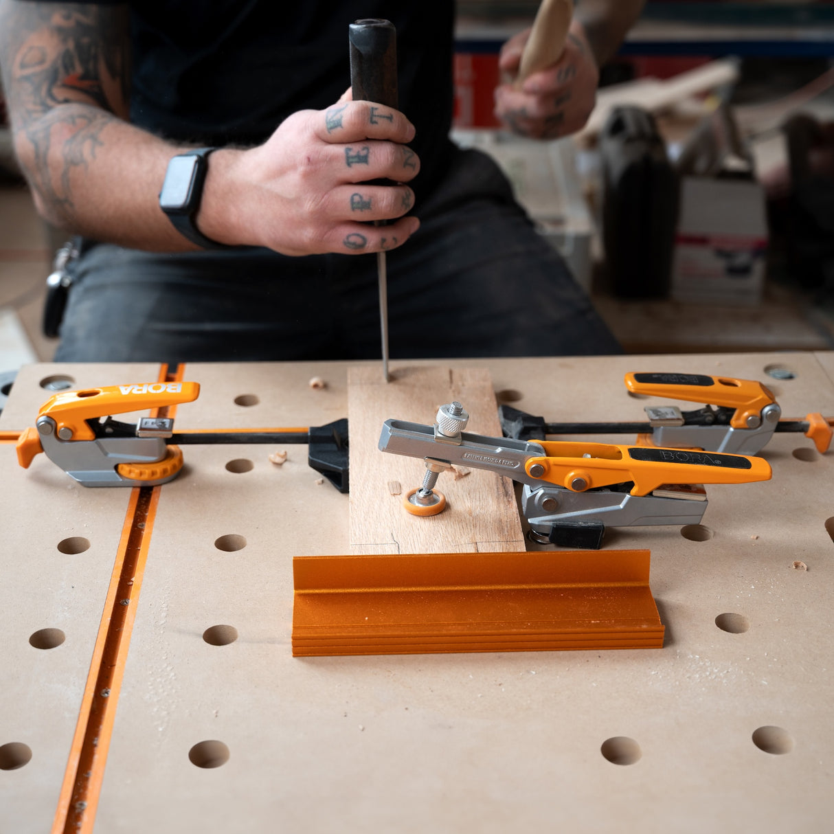 BORA Tool Dog Hole Auto Adjust Inline Clamp in action on workbench