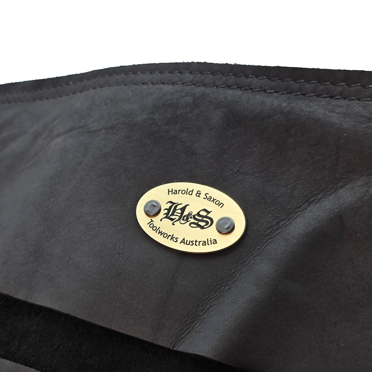 Harold & Saxon Deluxe Tanned Leather Tool Roll holding nine tools, showcasing quality Australian craftsmanship