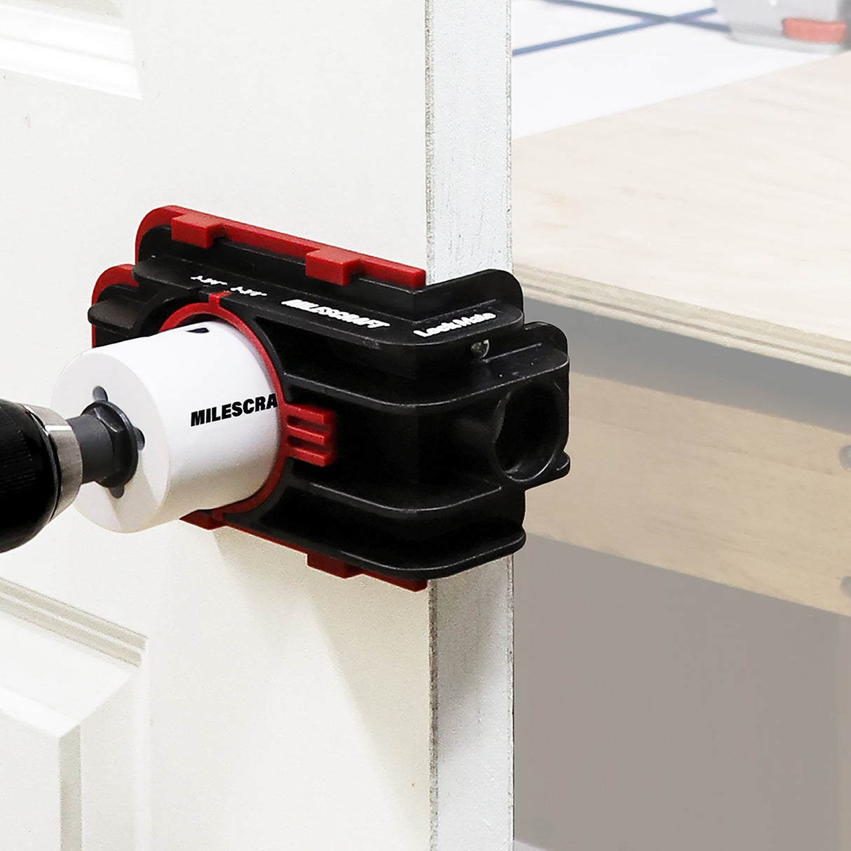 Milescraft LockMate Lock & Knob Installation Jig in use on a door installation
