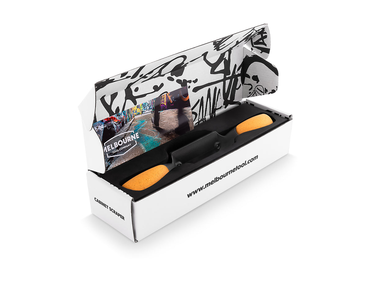 Melbourne Tool Company Cabinet Scraper with Carbon Steel Blade and Ergonomic Handles in use on wood surface