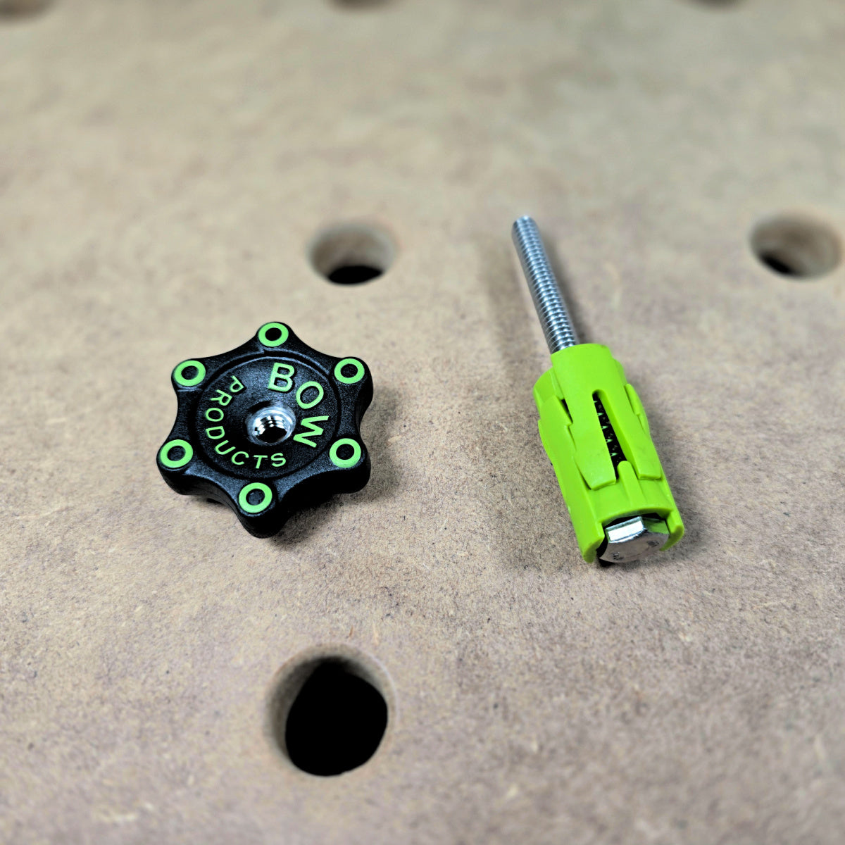 Bow Products Pack of Dogs Expandable Woodworking Bench Dogs in use on a wooden workbench