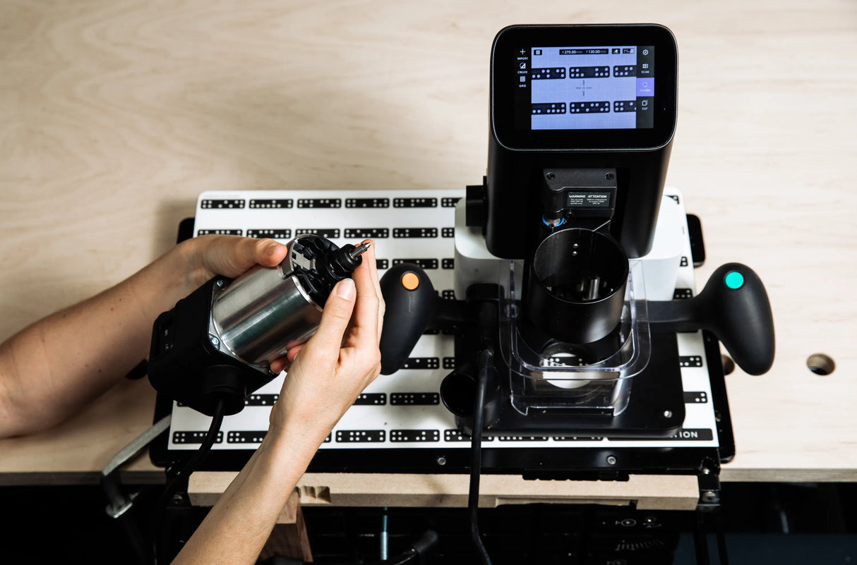 Shaper Tools 90 Degree Engraving CNC Router Bit 1/4in Shank in use on hardwood, showcasing precise engraving capabilities