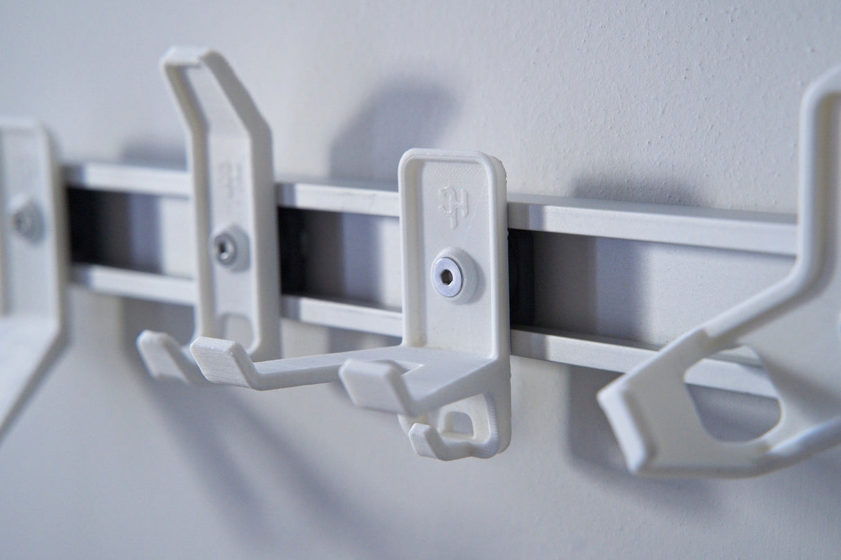 Superhooks Multi Hook White 3 Pack on wall with reinforced double arm hook and small securing hook