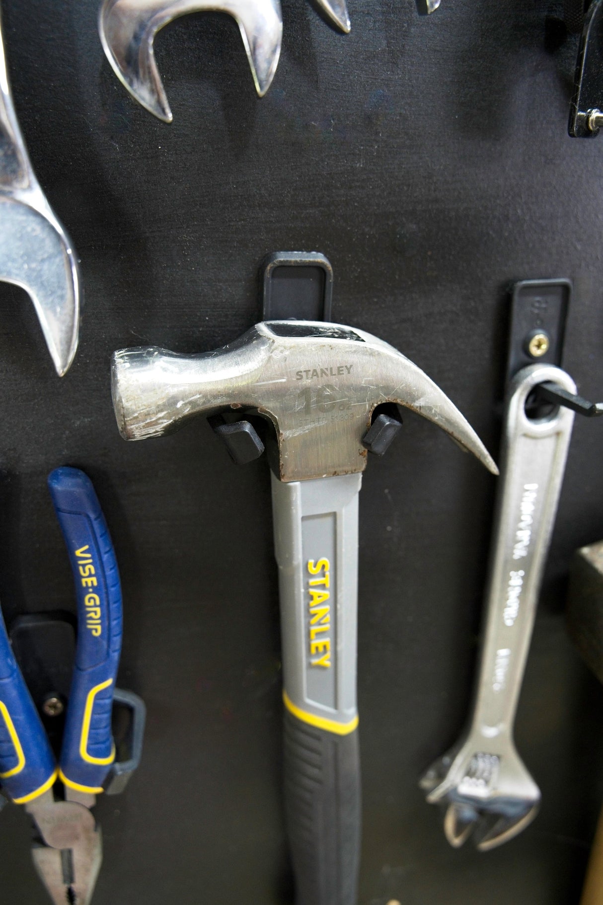 Black modular tool wall hooks from the Superhooks Starter Bundle, showcasing heavy-duty design and high weight capacity