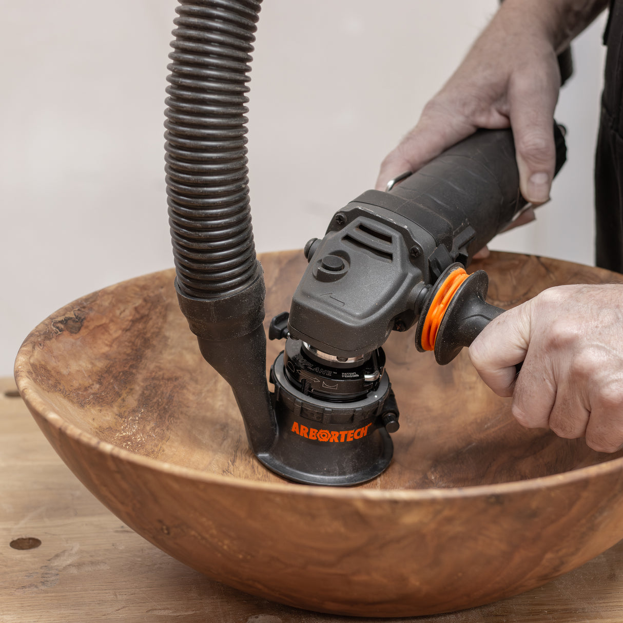 Arbortech SpheroPlane angle grinder attachment carving wooden sphere with adjustable radius for convex & concave projects