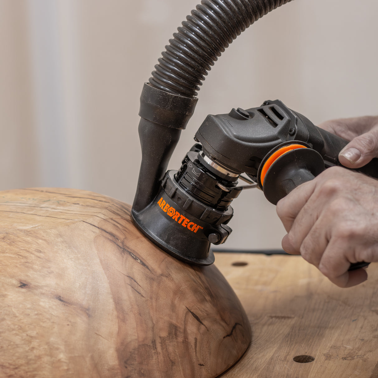 Arbortech SpheroPlane grinder attachment carving a spherical wooden bowl