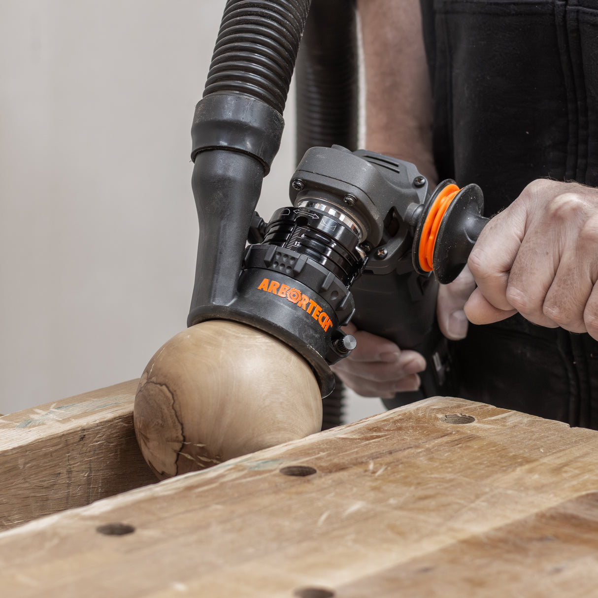 Arbortech SpheroPlane in use, creating smooth curves on wooden surface
