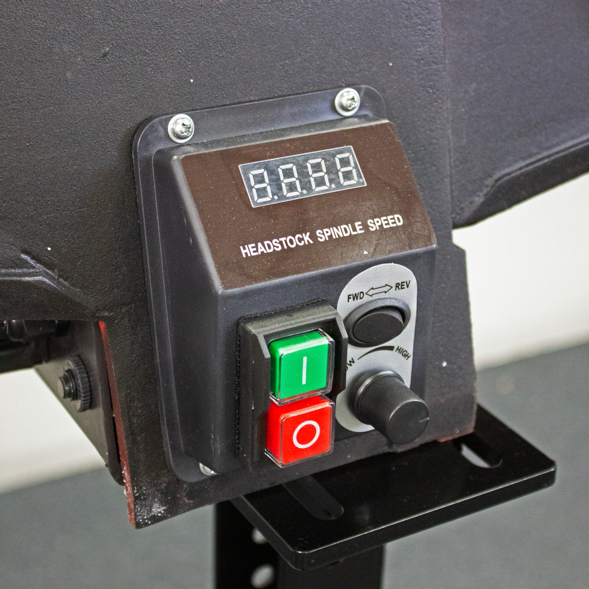 Control panel with digital display and buttons on a machine lathe