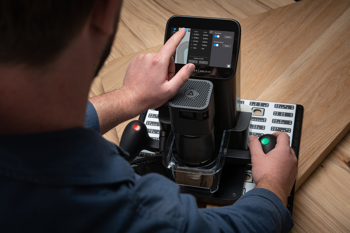 Shaper Tools Origin Handheld CNC Router with Plate Bundle in use on a wooden project