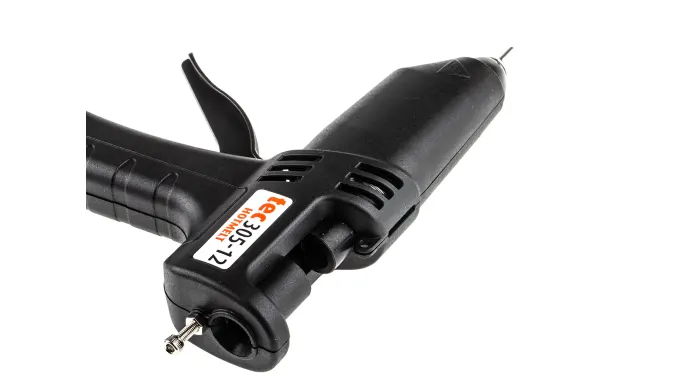 Power Adhesives Knottec Light Industrial Wood Repair Kit - Hot glue gun applicator on wooden surface