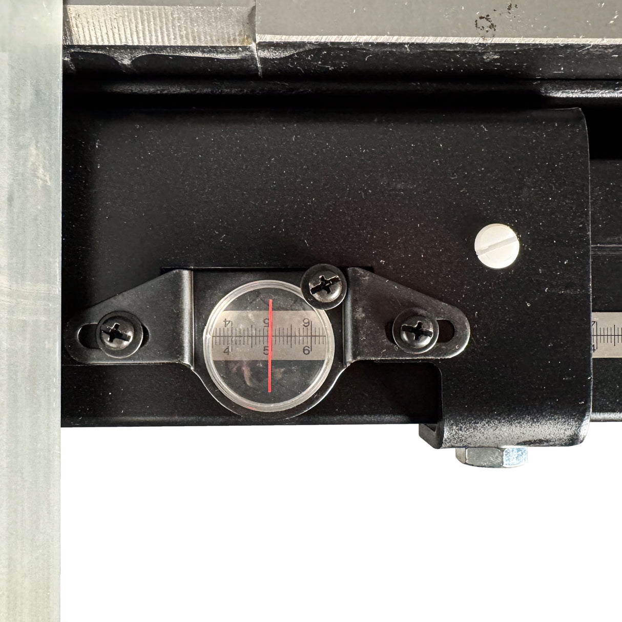 Torquata Stainless Steel Self-Adhesive Measuring Tape in metric, attached to woodworking bench