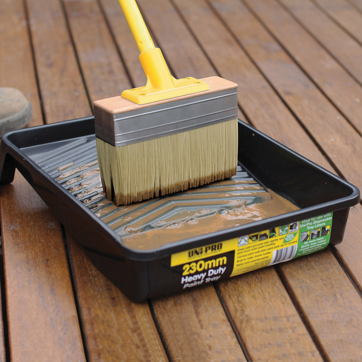 UniPro Jumbo Decking Brush applying stain between boards, 175mm width