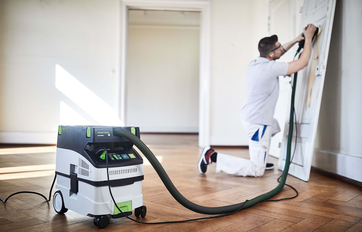 Festool CTM MIDI-I 15L M Class Dust Extractor in use on wooden workbench