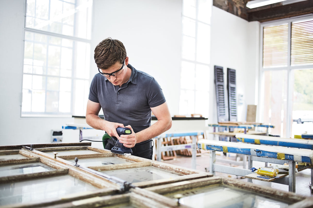 Festool DTS 400 REQ Orbital Iron Head Sander in use on a wooden surface