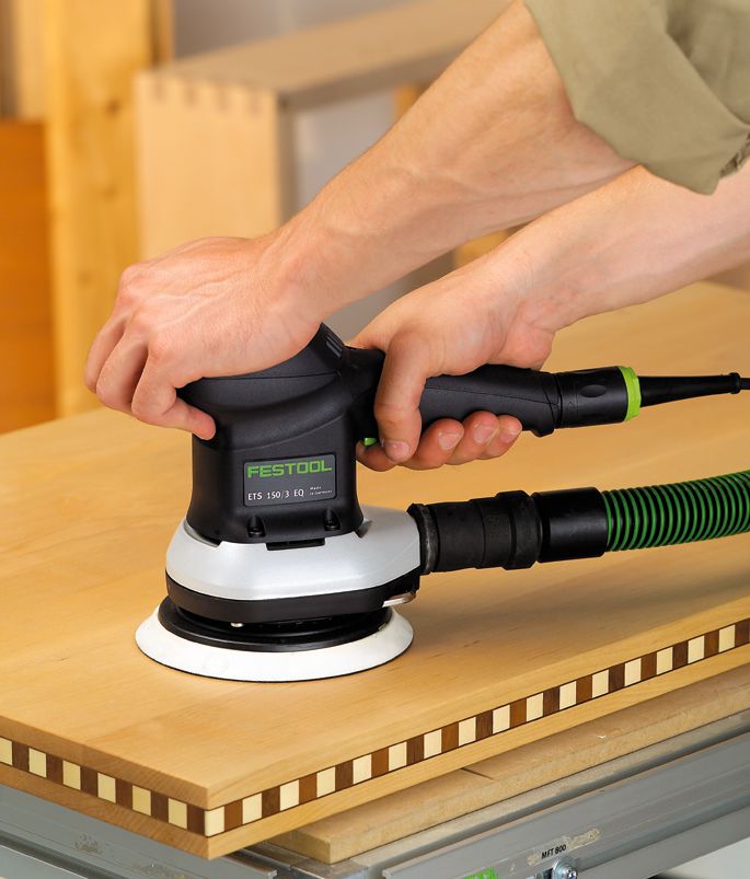 Festool ETS 150mm Random Orbital Sander in Systainer, angled view showing fine sanding application