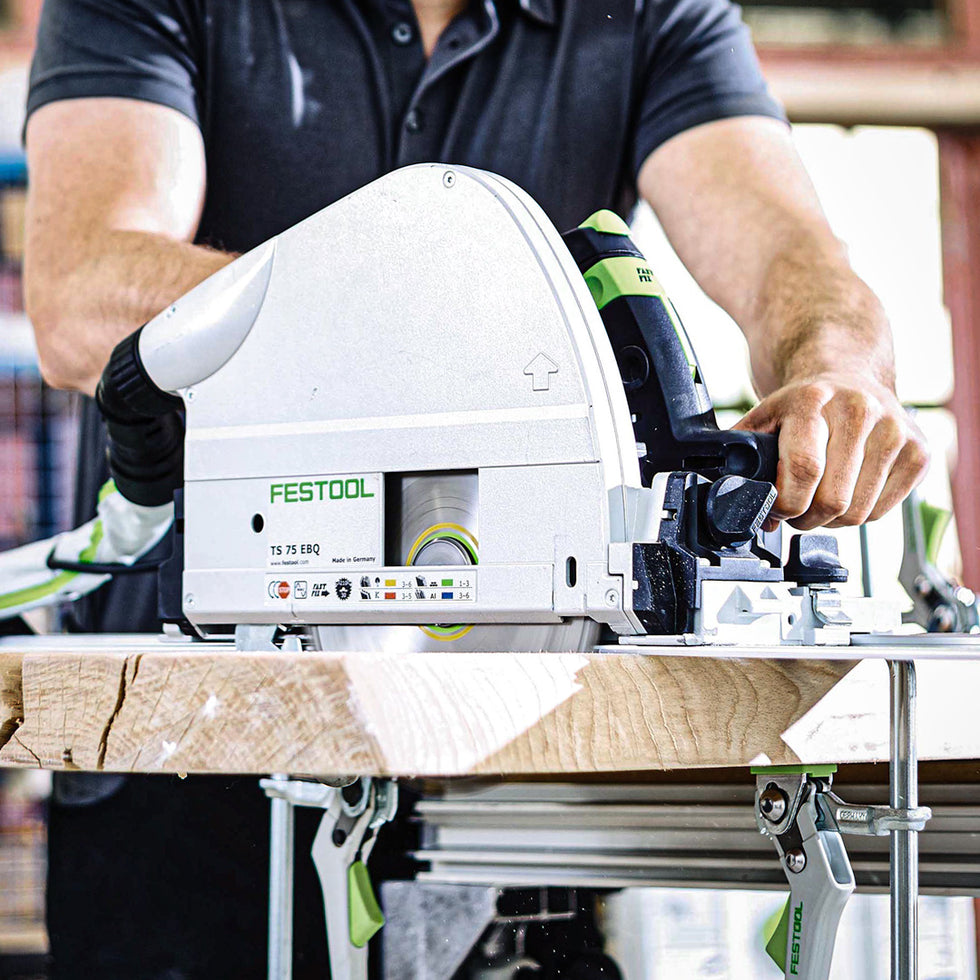 Person using a Festool circular saw on a workbench