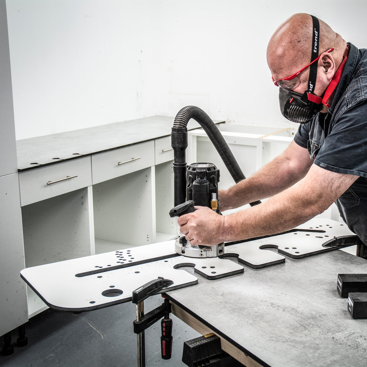 Trend 950mm Kitchen Worktop Router Jig in use on timber surface, showcasing precise mitre joint routing capabilities
