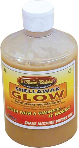 U Beaut Shellawax Glow Friction Polish 500mL bottle on a rustic wooden surface