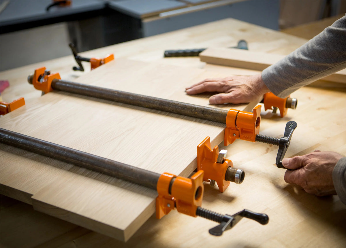 Pony Jorgensen Set of 6 Classic Clutched Pipe Clamp Fixtures in use on woodworking project