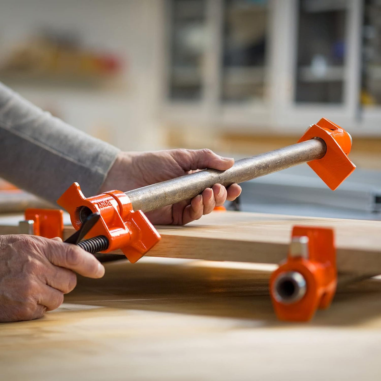 Pony Jorgensen Classic Clutched Pipe Clamp Fixture with 1800mm 3/4in Threaded Pipe in use on workbench
