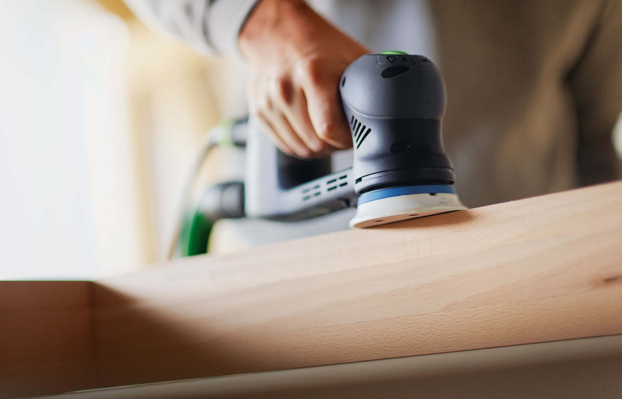 Festool RO 90mm ROTEX 4-in-1 sander in Systainer, angled application shot showing versatility and precision