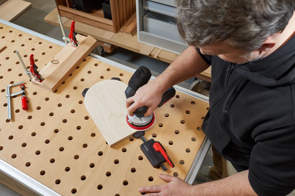 Bessey Horizontal Fixture Clamps in action on a wooden workbench
