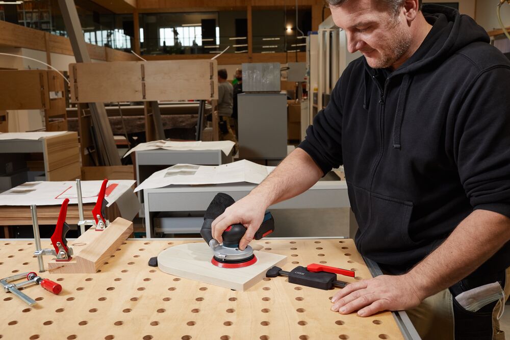 Bessey Horizontal Fixture Clamps in use on wooden workbench