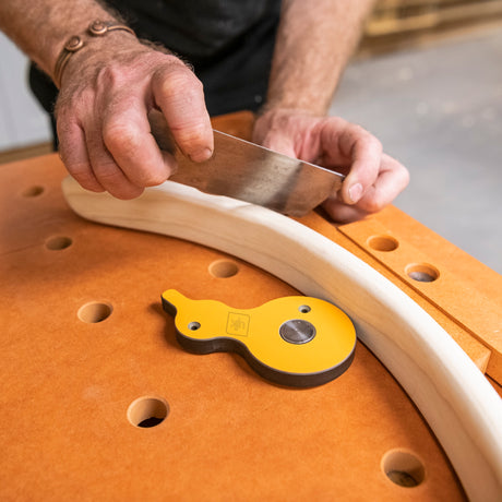UJK Surface Cam Clamps Pack of 2 for Dog Hole Workbenches in use on a woodworking table with 20mm dog holes