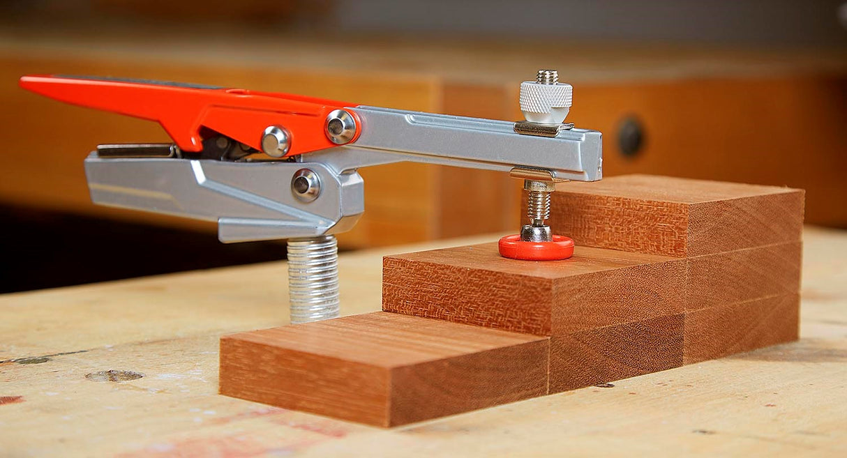 Armor Tool Auto-PRO Bench Dog Hold-Down Clamp in use on woodworking workbench