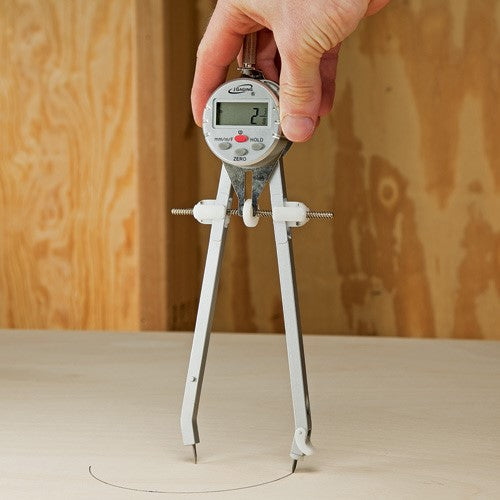 LCD display on iGaging Digital Compass showing precise measurements in millimetres, inches, and fractions